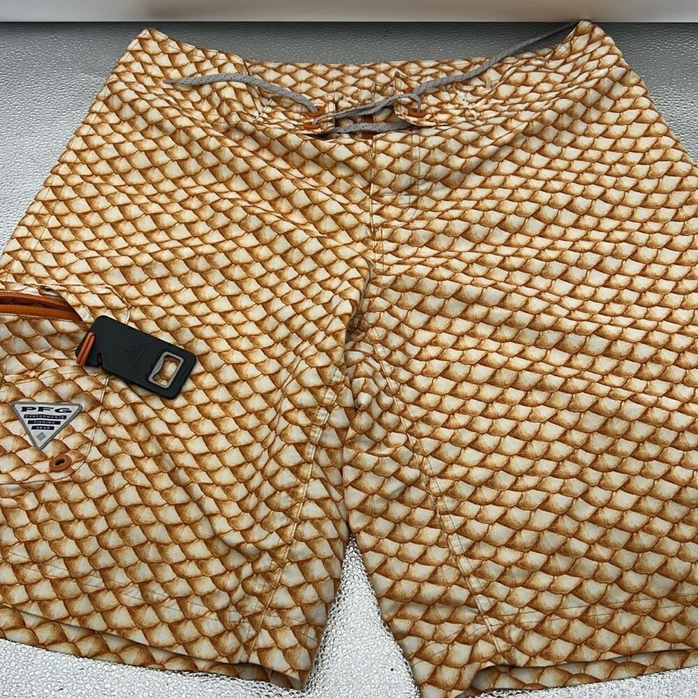 Columbia board shorts with fish scale print and bottle opener
